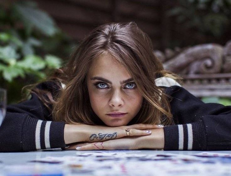 Cara-Delevingne tattoos hand finger arm meanings
