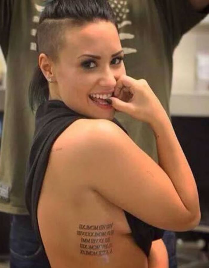 Demi Lovato's Roman numerals tattoo is on the side of her breast